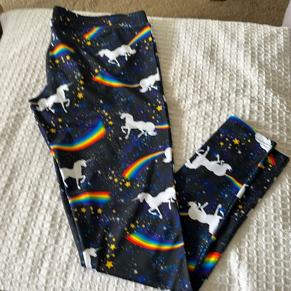 Large leggings with unicorns and rainbows on them.